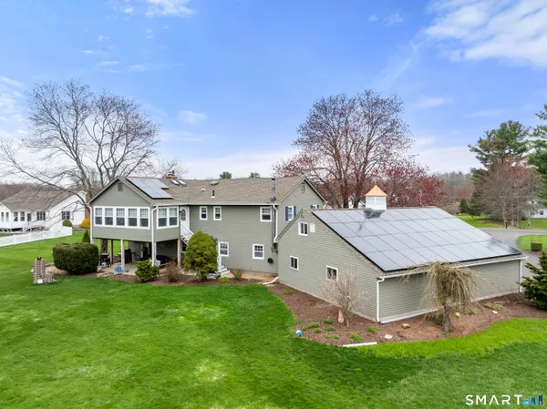 a kitchen with stainless steel appliances granite countertop a refrigerator a stove top oven a sink and dishwasher
