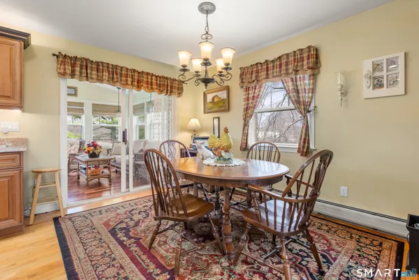 a living room filled with furniture and floor to ceiling windows