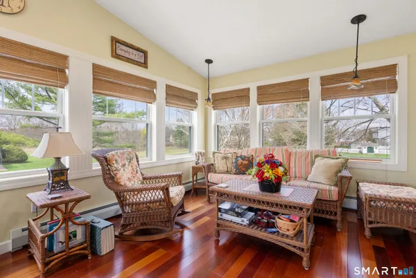 a living room with furniture and a large window
