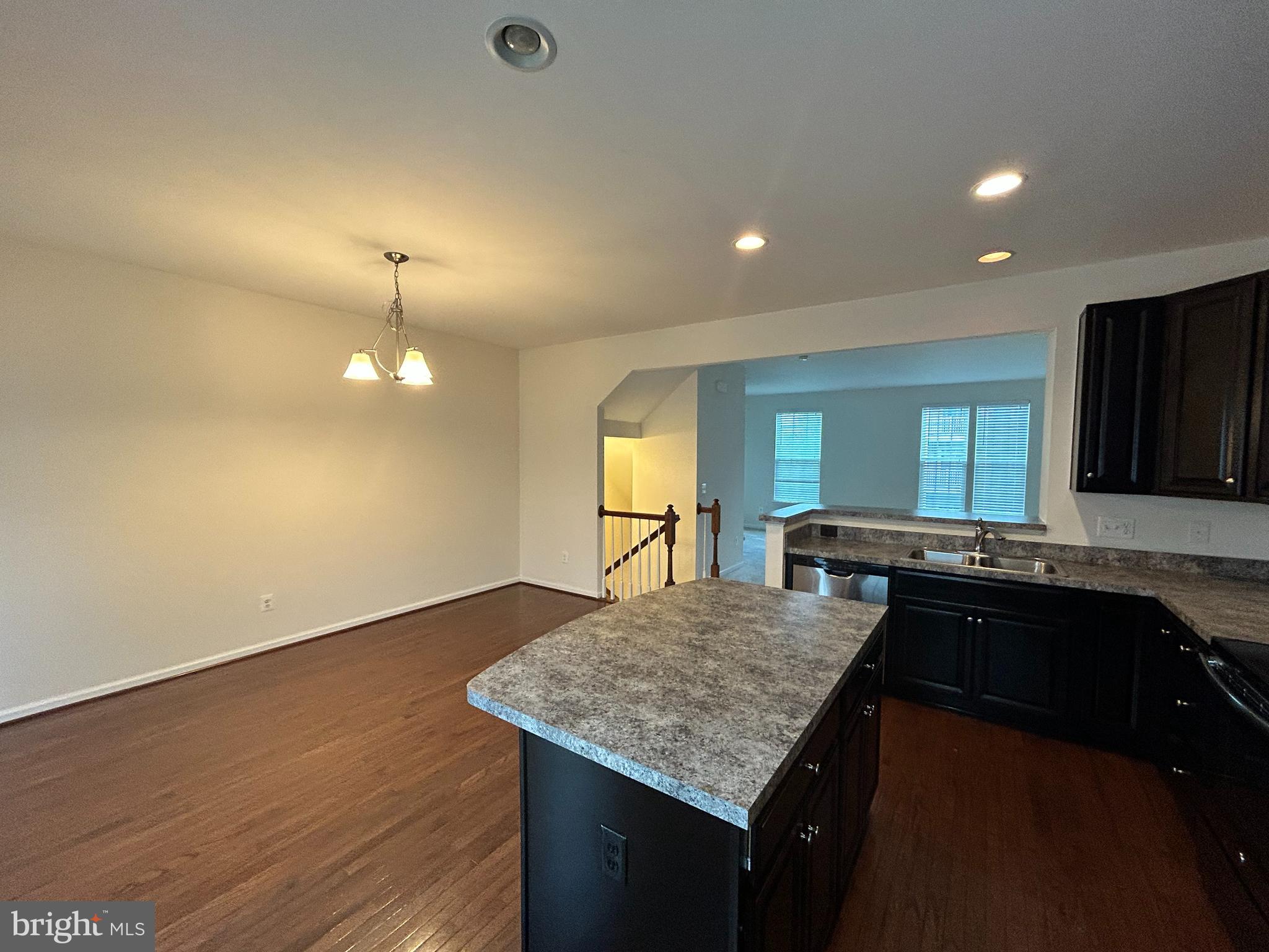 6170 Willow Place Bealeton, VA 22712 - Photo 11 of 28 a kitchen with kitchen island a sink dishwasher a stove and a refrigerator with wooden floor