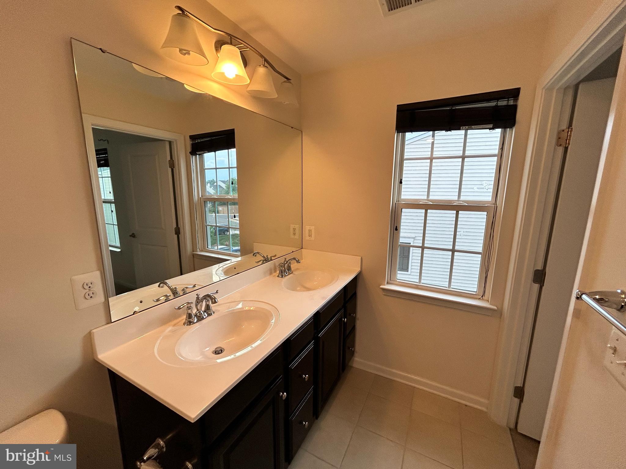 6170 Willow Place Bealeton, VA 22712 - Photo 18 of 28 a bathroom with a sink and a mirror