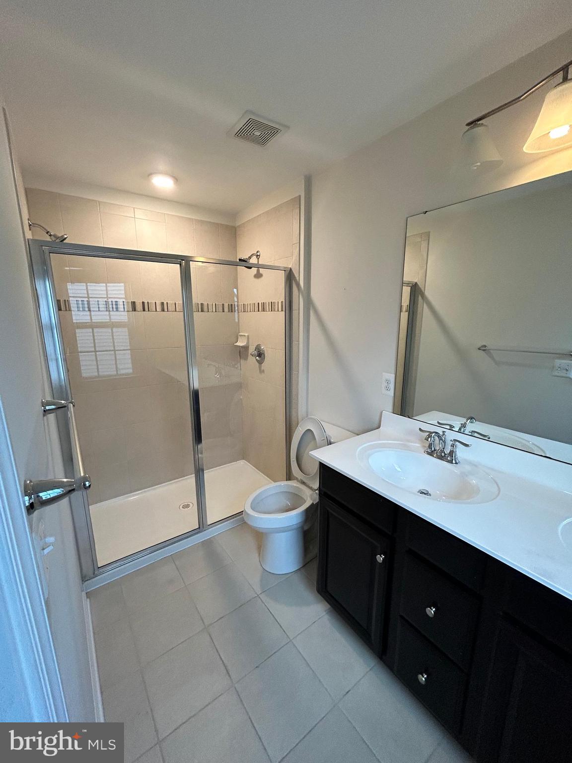6170 Willow Place Bealeton, VA 22712 - Photo 20 of 28 a bathroom with a double vanity sink toilet and shower
