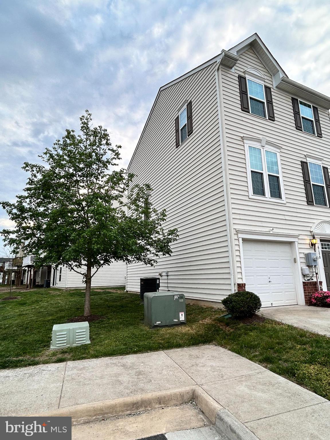 6170 Willow Place Bealeton, VA 22712 - Photo 26 of 28 a view of a white house with a yard and a large tree