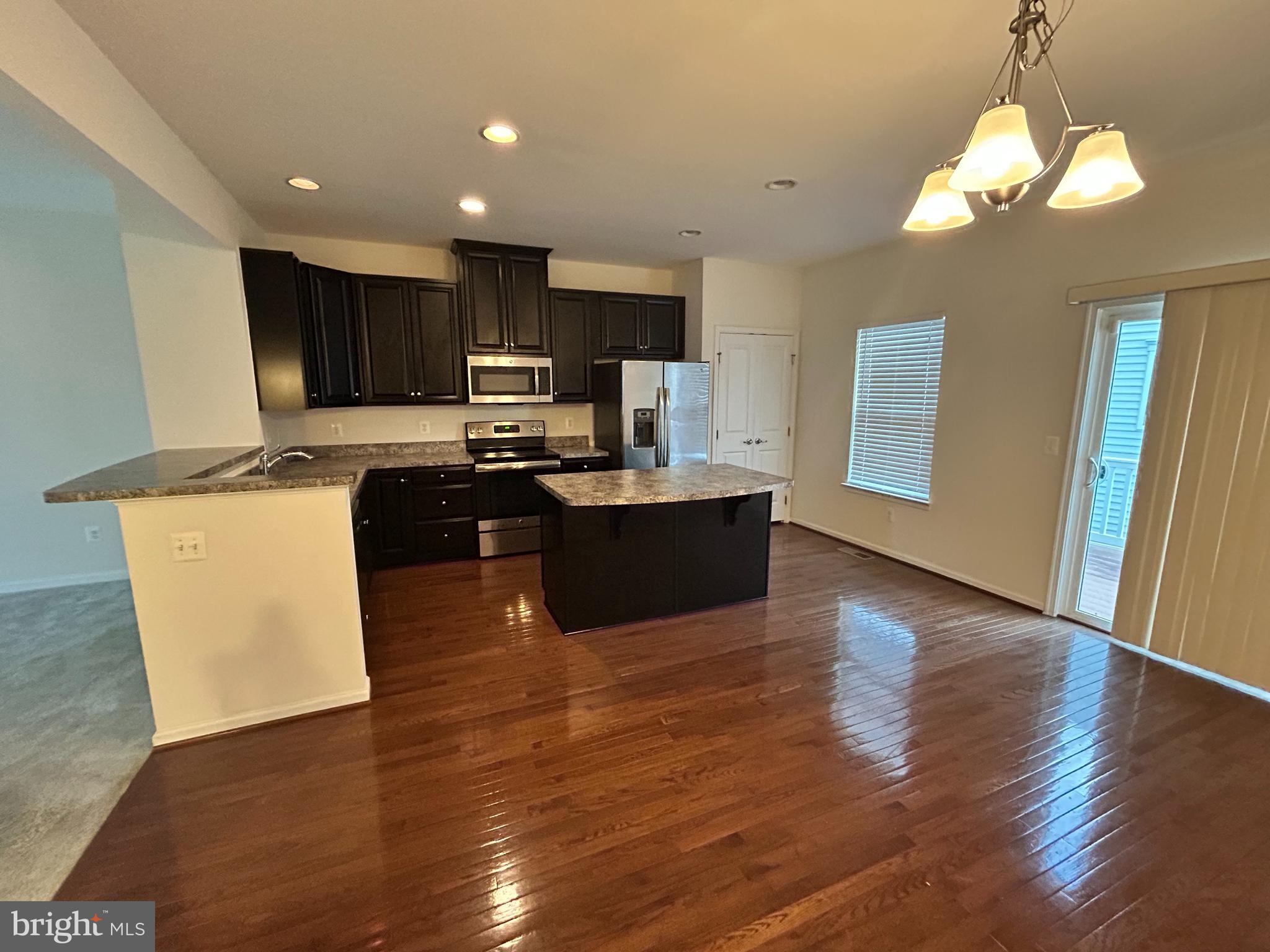 6170 Willow Place Bealeton, VA 22712 - Photo 8 of 28 a view of kitchen with sink microwave and refrigerator