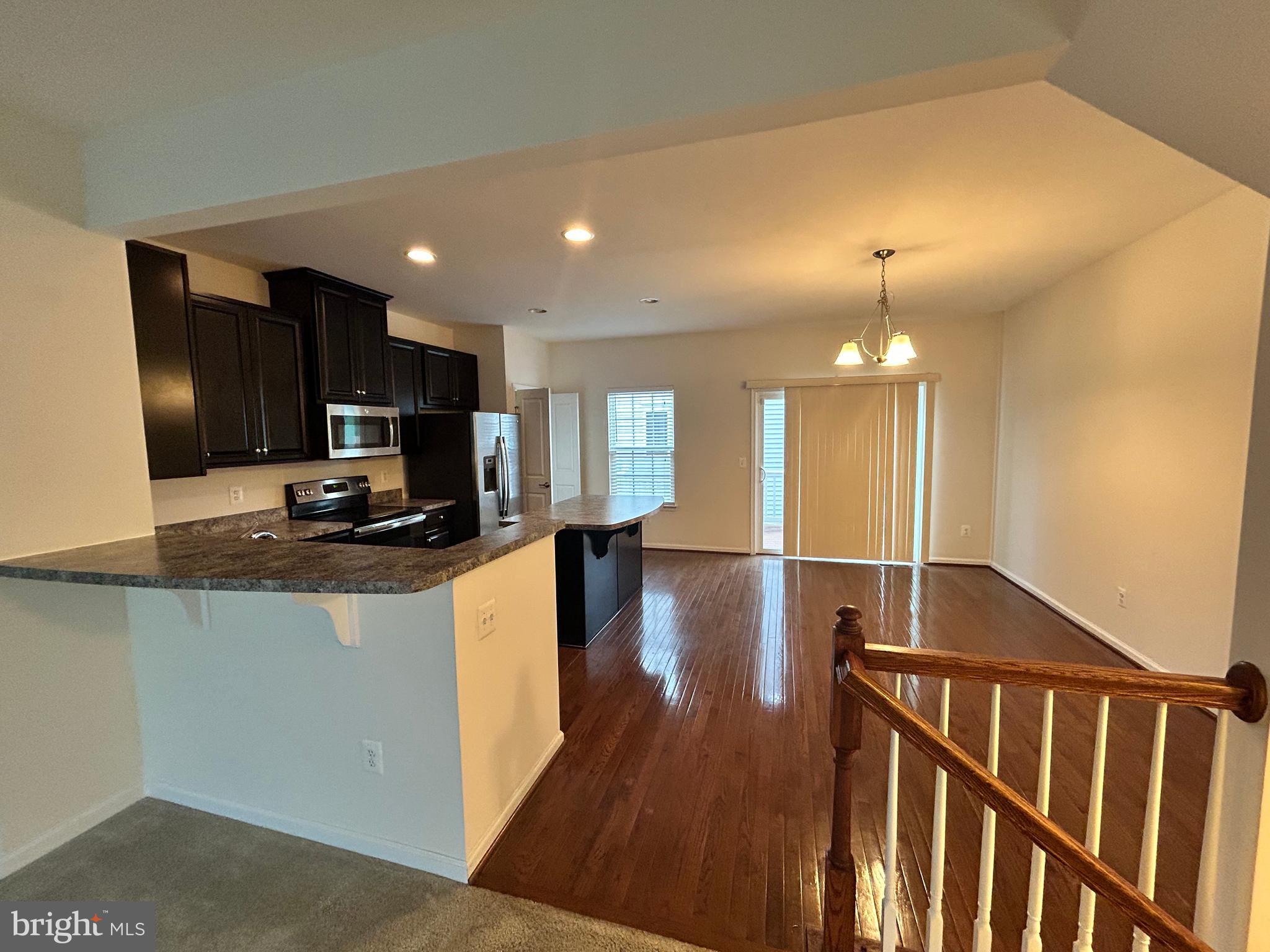 6170 Willow Place Bealeton, VA 22712 - Photo 10 of 28 a kitchen with stainless steel appliances granite countertop a sink stove and refrigerator