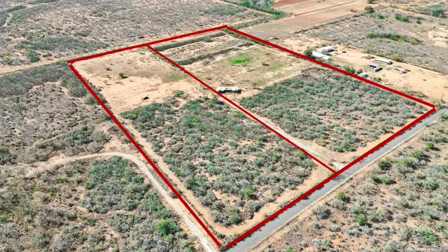 a terrace with a bench and trees
