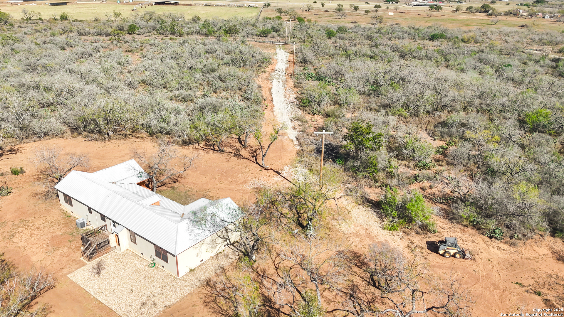12-acres County Rd 307 Jourdanton, TX 78026 - Photo 3 of 8 a terrace with a bench and trees