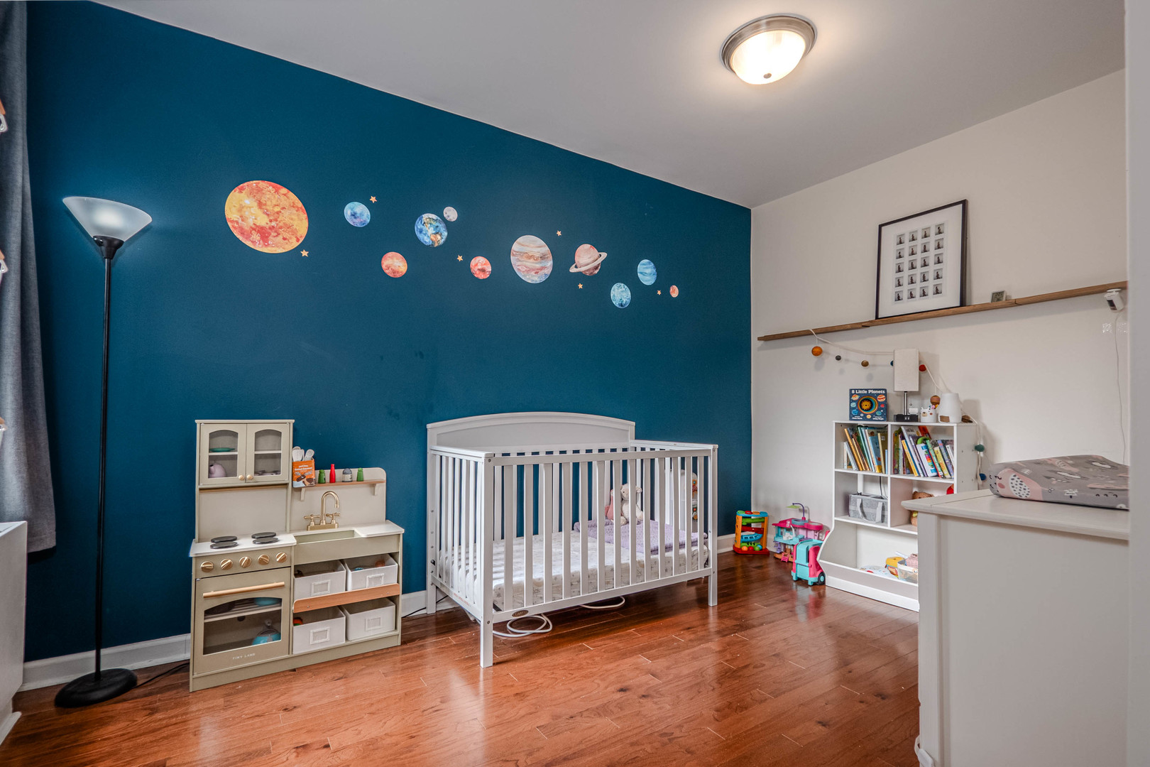 525 West Hawthorne Place, Unit 101 Chicago, IL 60657 - Photo 15 of 28 a bedroom with furniture and a wooden floor