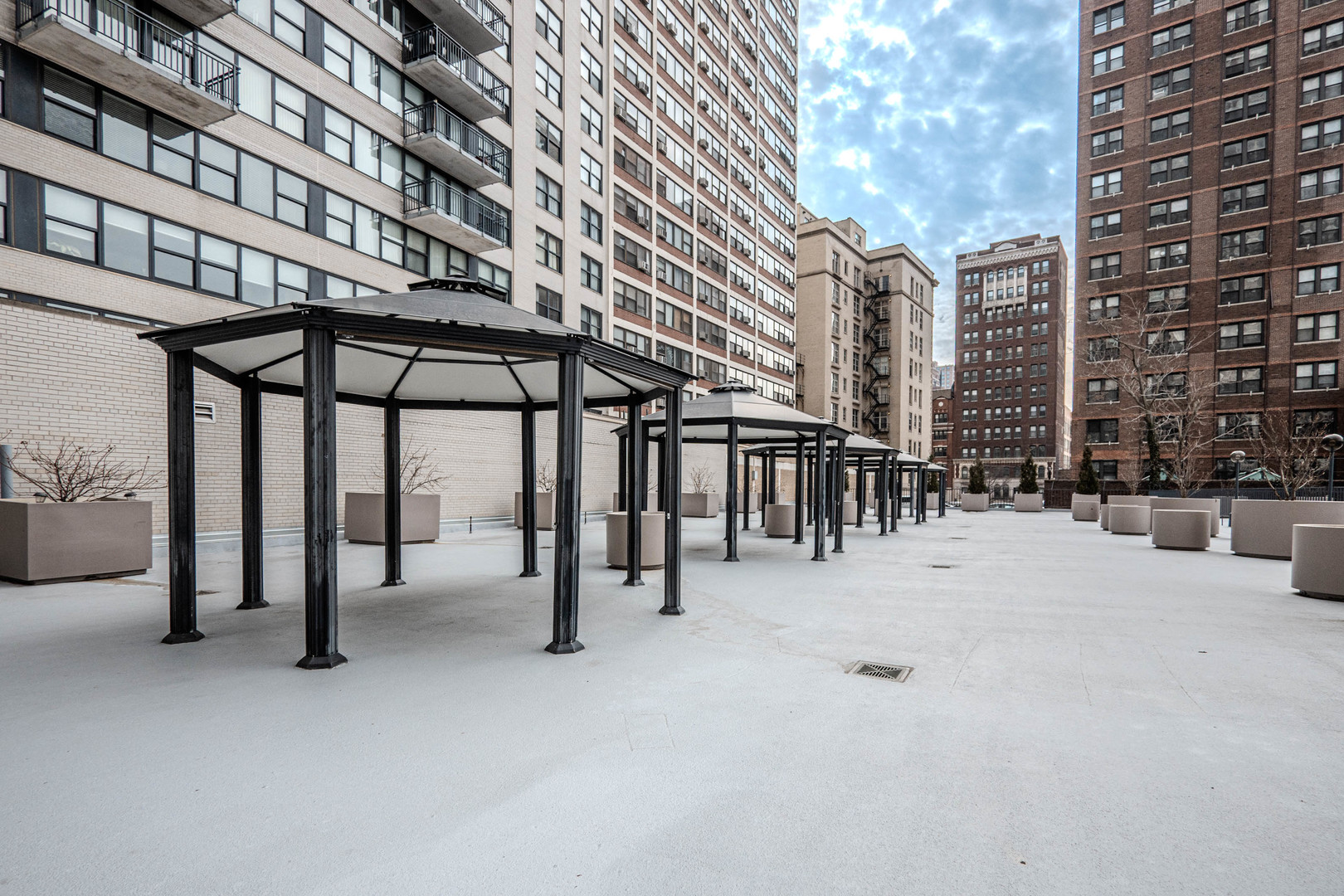 525 West Hawthorne Place, Unit 101 Chicago, IL 60657 - Photo 22 of 28 a view of a water fountain and a building in the background