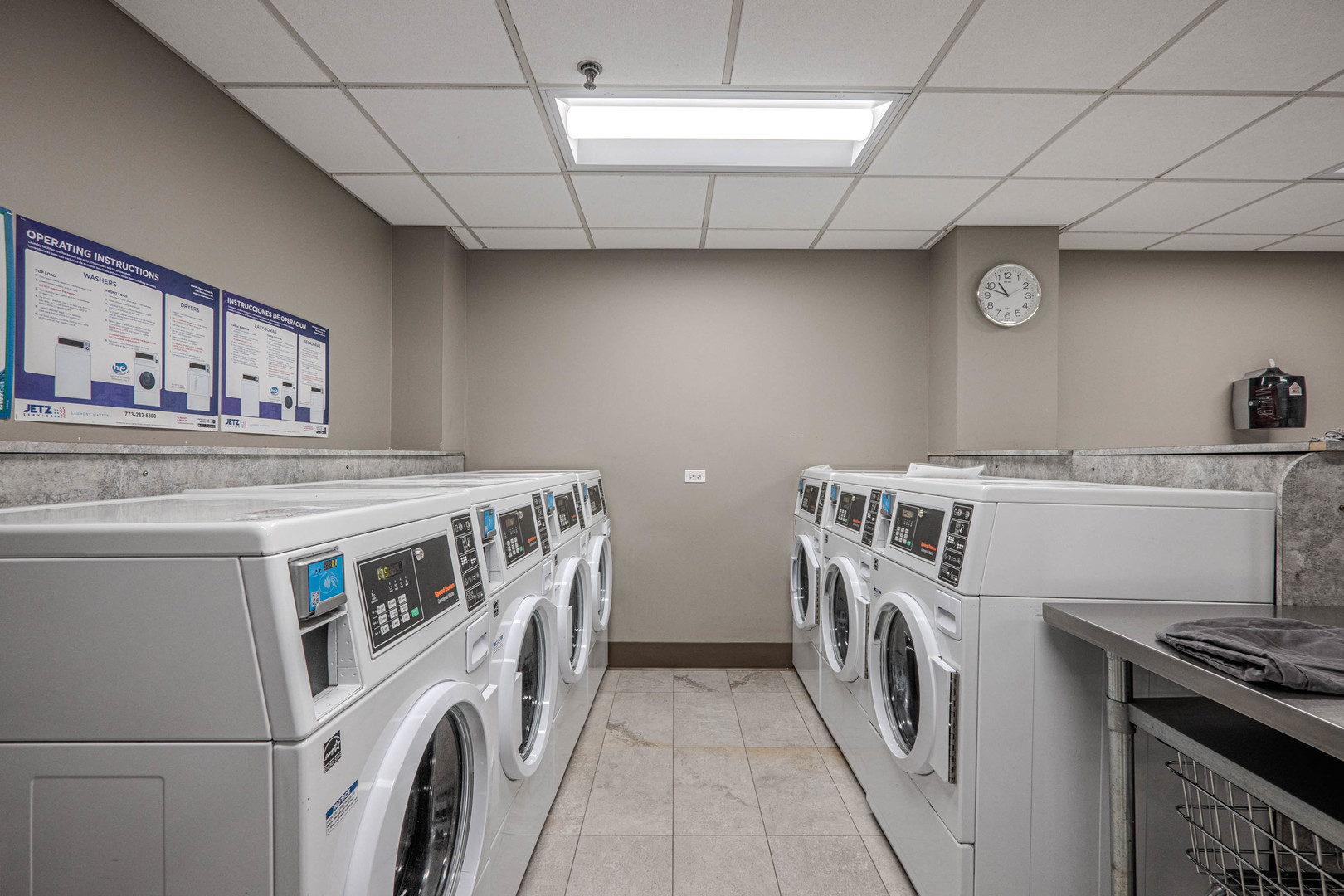 525 West Hawthorne Place, Unit 101 Chicago, IL 60657 - Photo 27 of 28 a utility room with dryer and washer