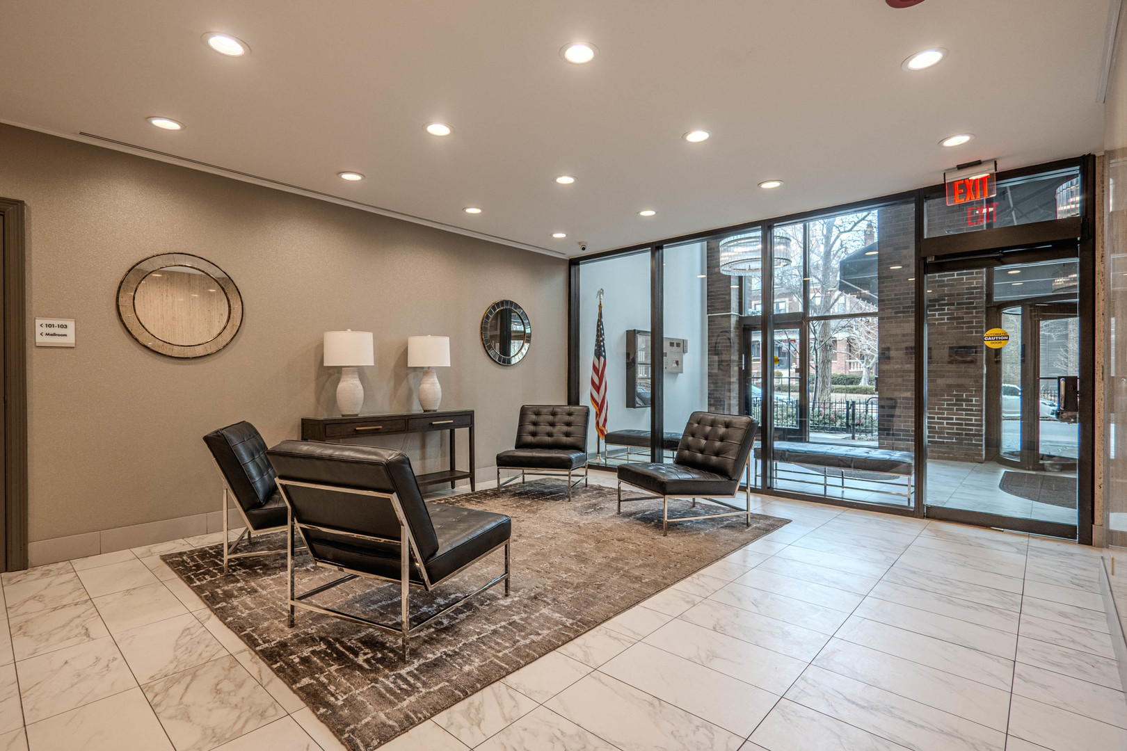 525 West Hawthorne Place, Unit 101 Chicago, IL 60657 - Photo 5 of 28 a living room with fireplace furniture and a large window