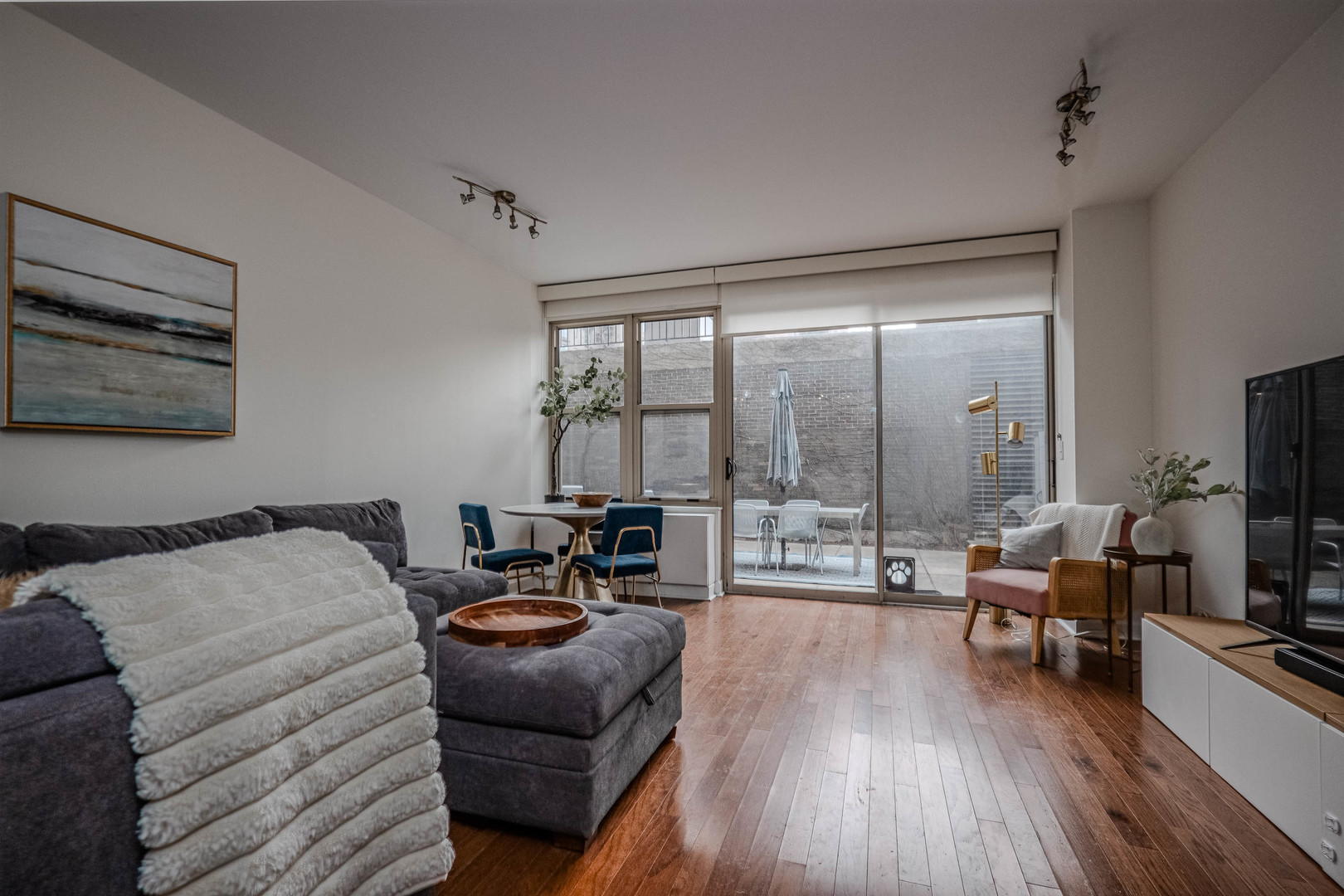 525 West Hawthorne Place, Unit 101 Chicago, IL 60657 - Photo 8 of 28 a bedroom with furniture and a large window