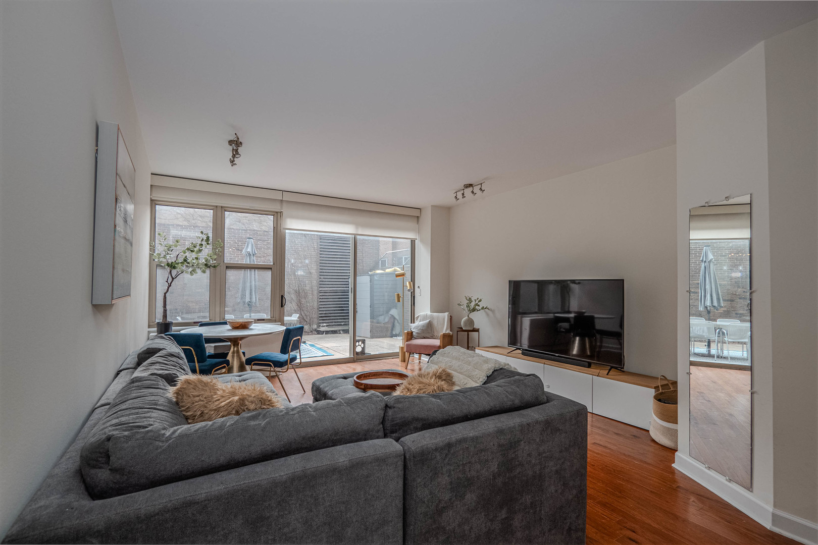 525 West Hawthorne Place, Unit 101 Chicago, IL 60657 - Photo 9 of 28 a living room with furniture and a flat screen tv
