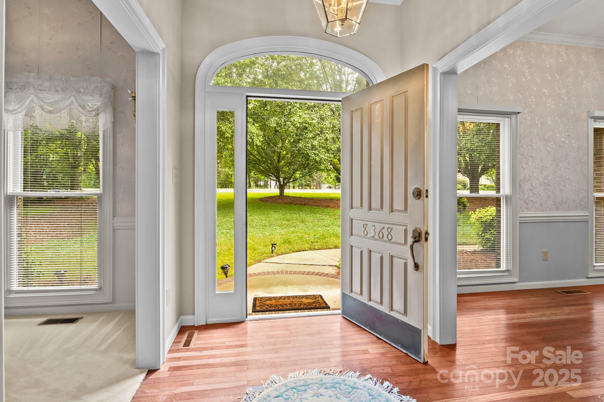 8368 Fairfield Forest Road Denver, NC 28037 - Photo 12 of 48 a view of an entryway with a garden