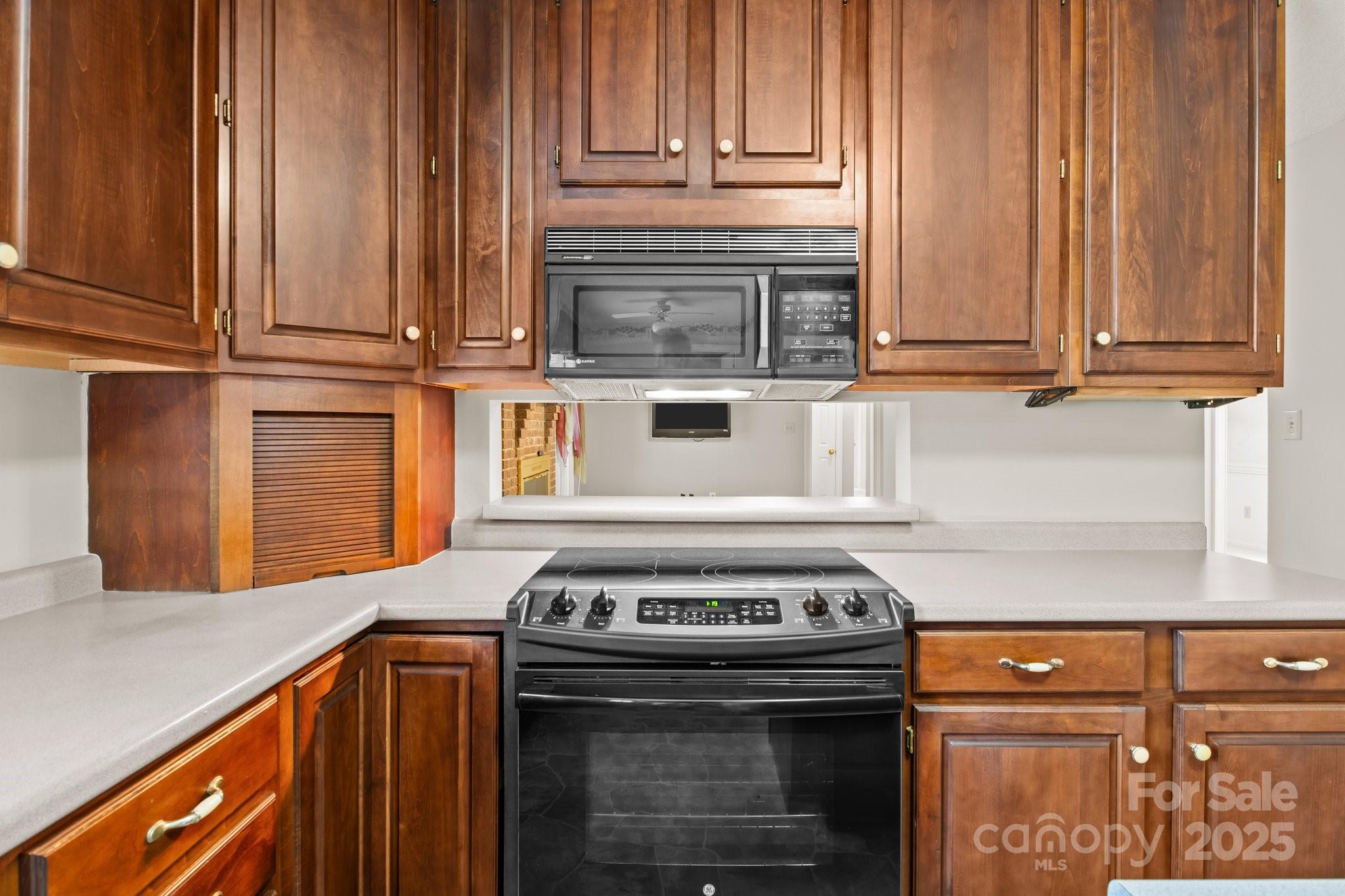 8368 Fairfield Forest Road Denver, NC 28037 - Photo 20 of 48 a kitchen with granite countertop a stove and a sink