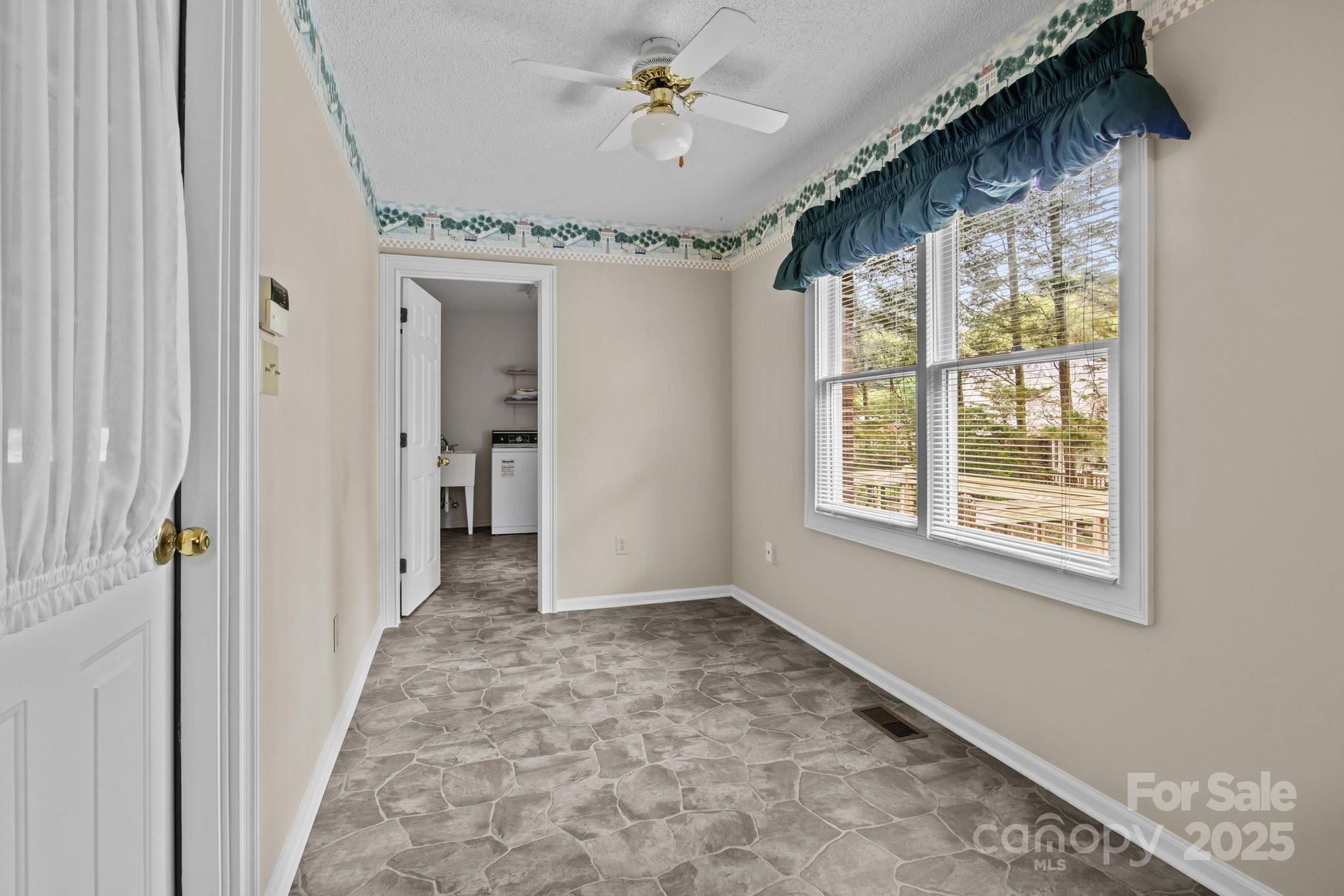 8368 Fairfield Forest Road Denver, NC 28037 - Photo 23 of 48 a view of a hallway with a chandelier