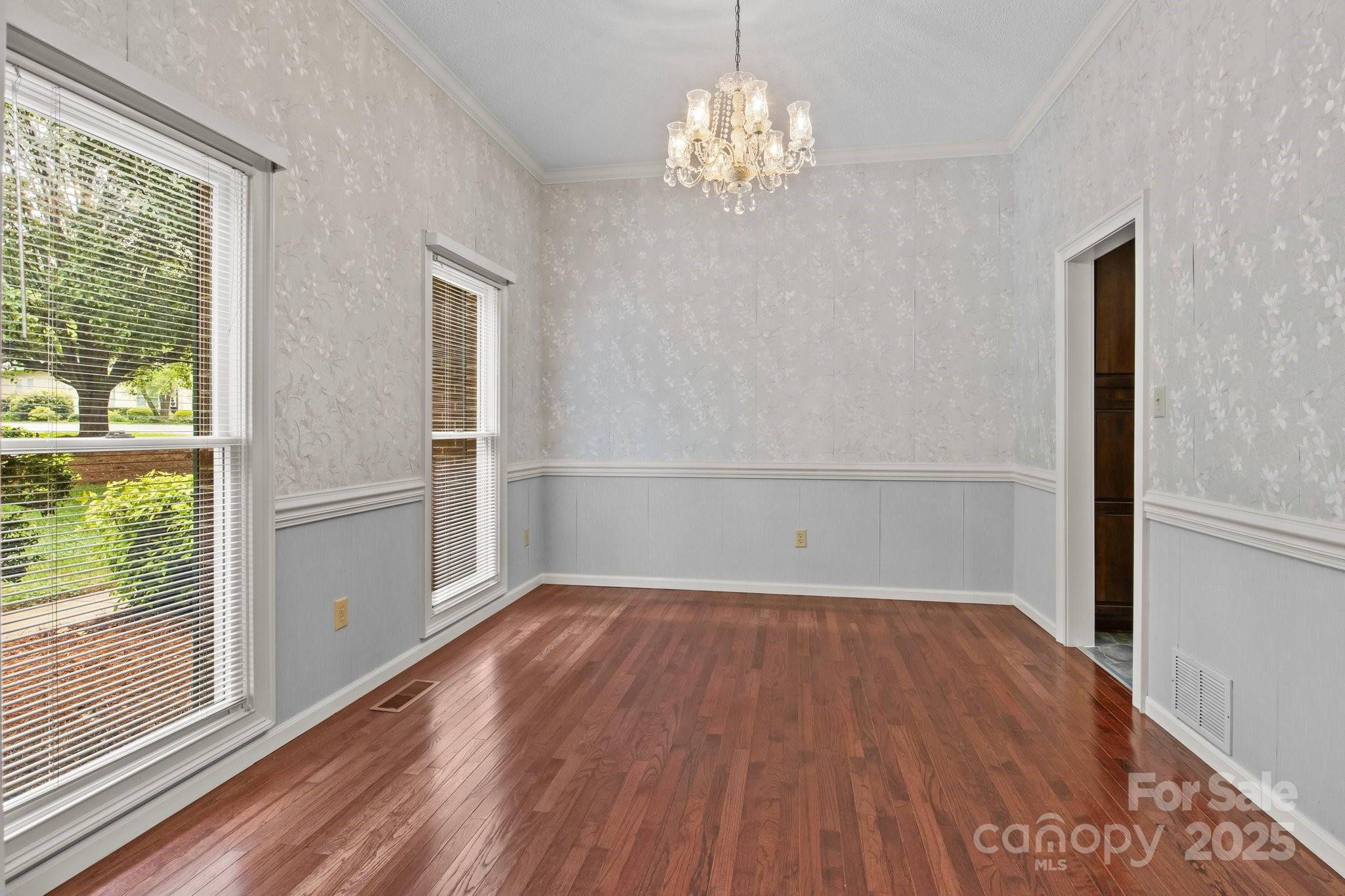 8368 Fairfield Forest Road Denver, NC 28037 - Photo 26 of 48 a view of empty room with wooden floor and fan