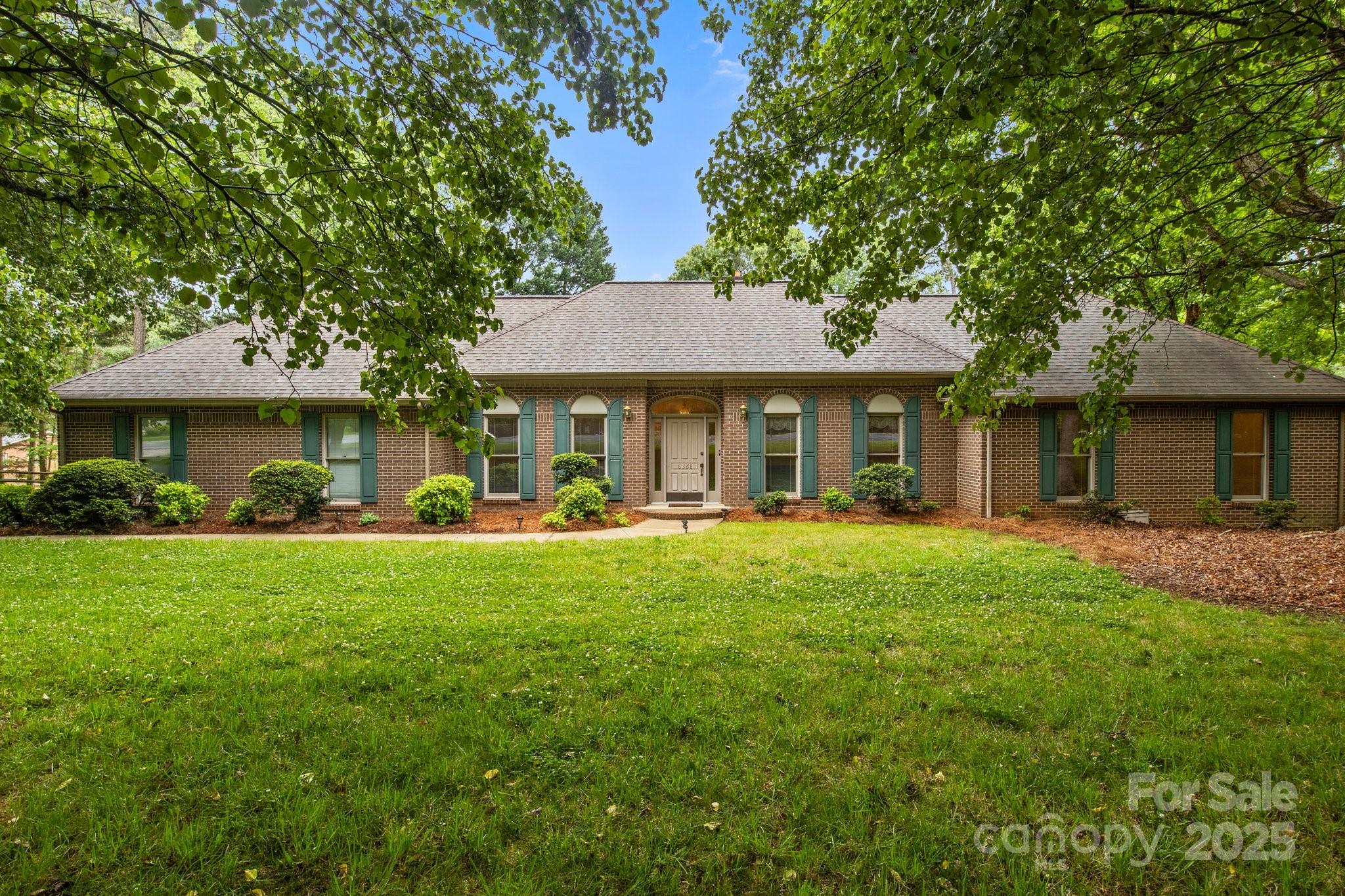 8368 Fairfield Forest Road Denver, NC 28037 - Photo 3 of 48 a front view of a house with a garden