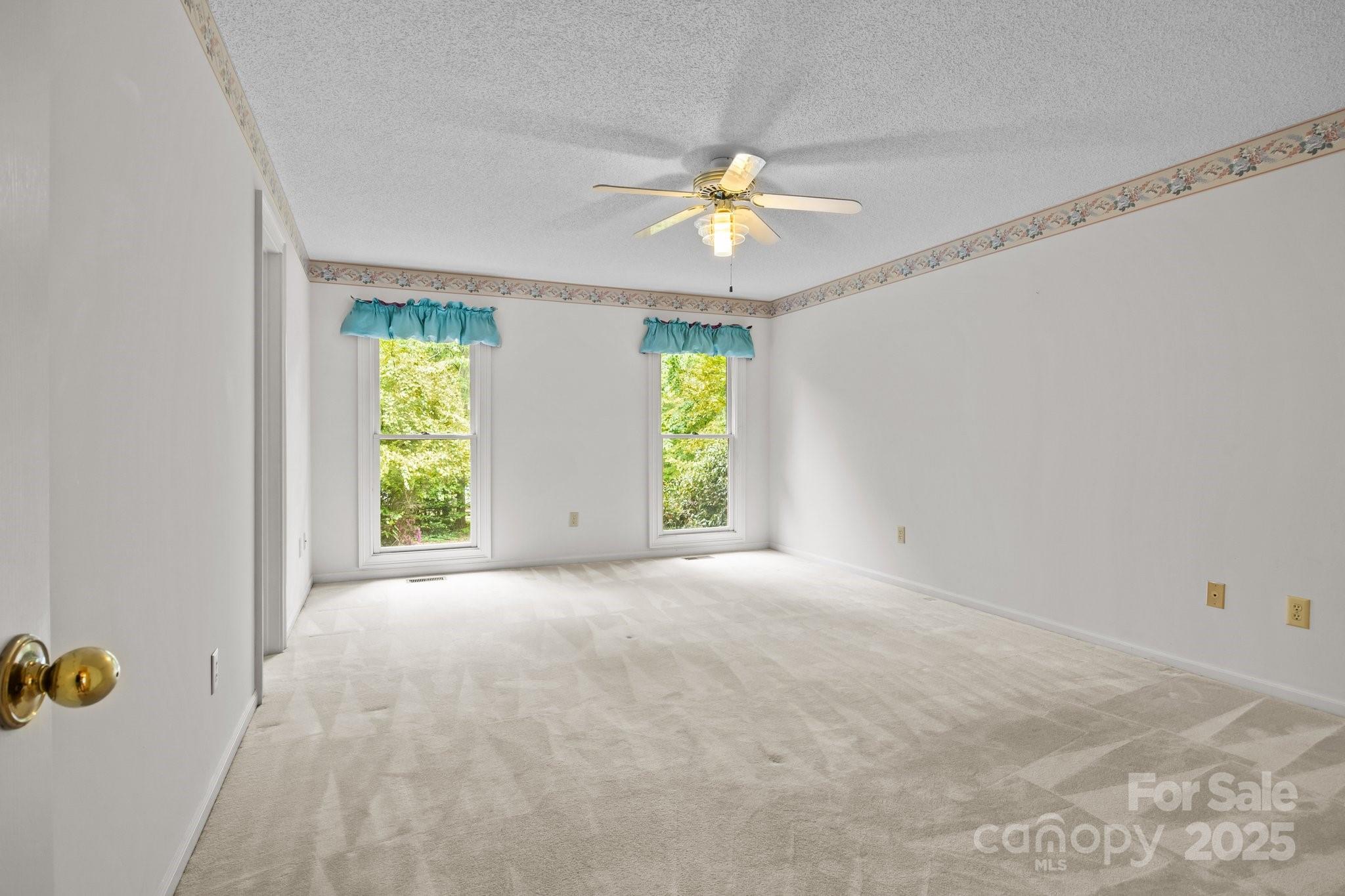 8368 Fairfield Forest Road Denver, NC 28037 - Photo 31 of 48 a view of an empty room with a window