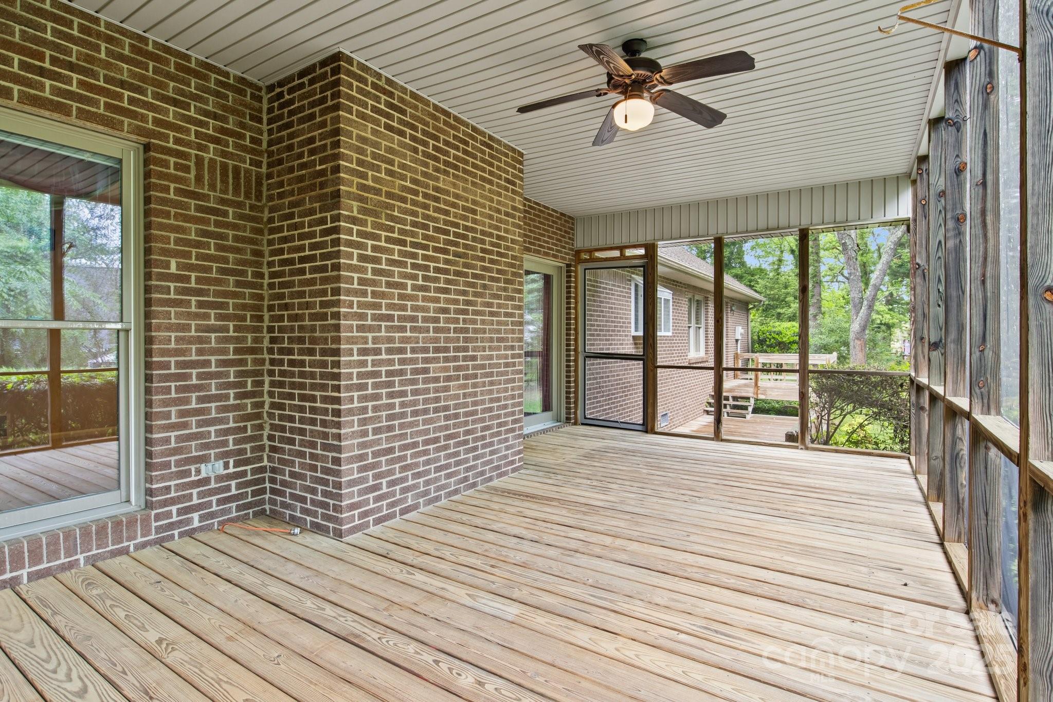 8368 Fairfield Forest Road Denver, NC 28037 - Photo 37 of 48 a view of a balcony with a ceiling fan