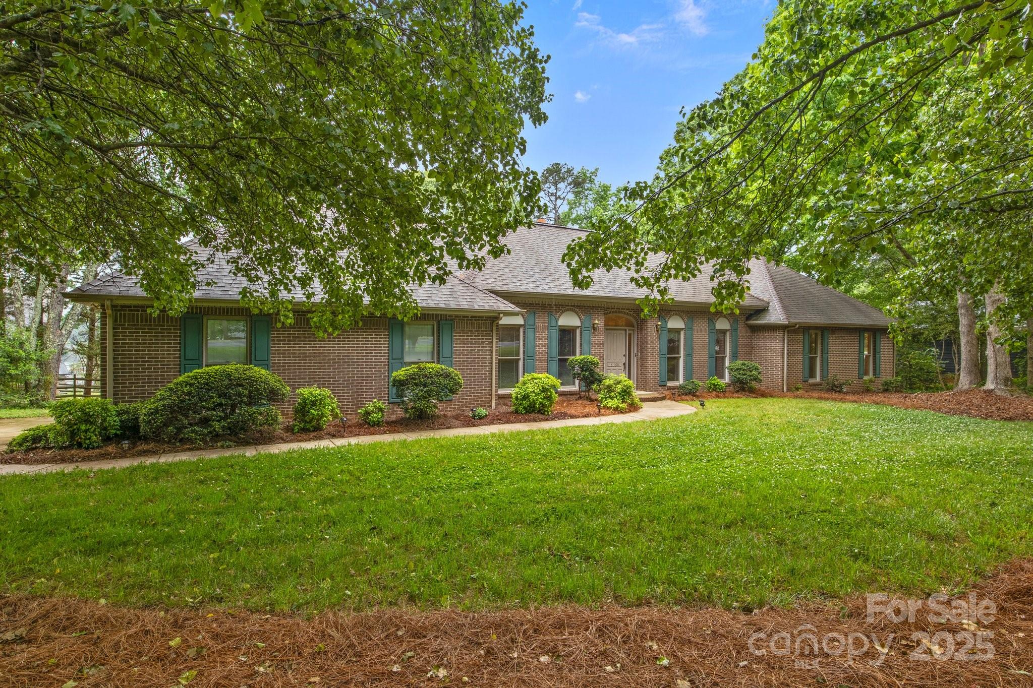 8368 Fairfield Forest Road Denver, NC 28037 - Photo 4 of 48 a front view of a house with yard patio and green space
