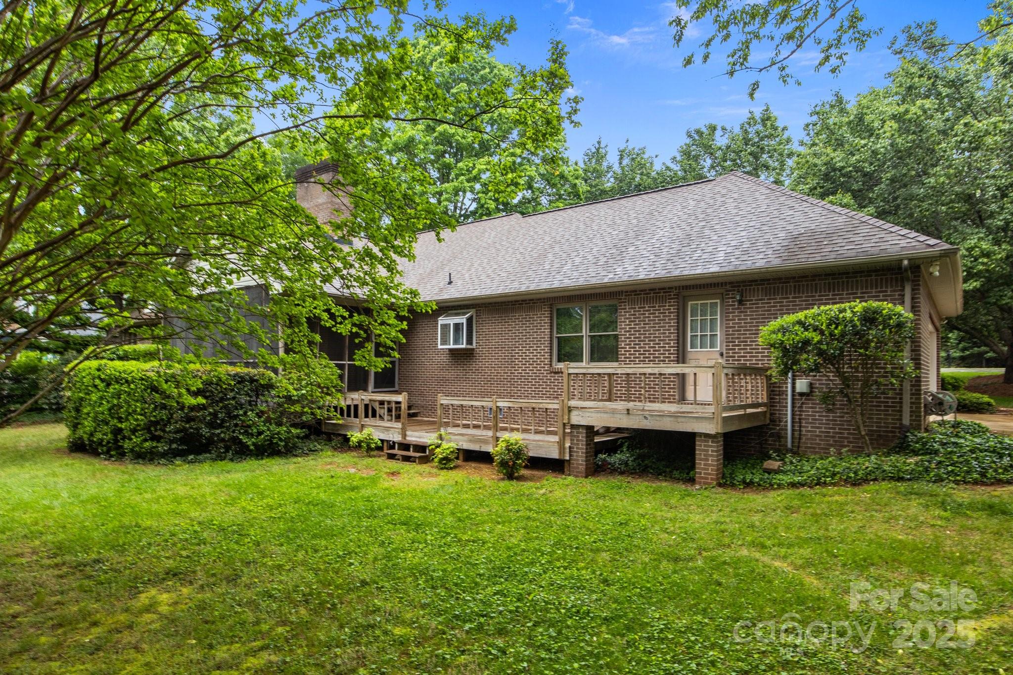 8368 Fairfield Forest Road Denver, NC 28037 - Photo 42 of 48 a view of a house with a backyard and a patio