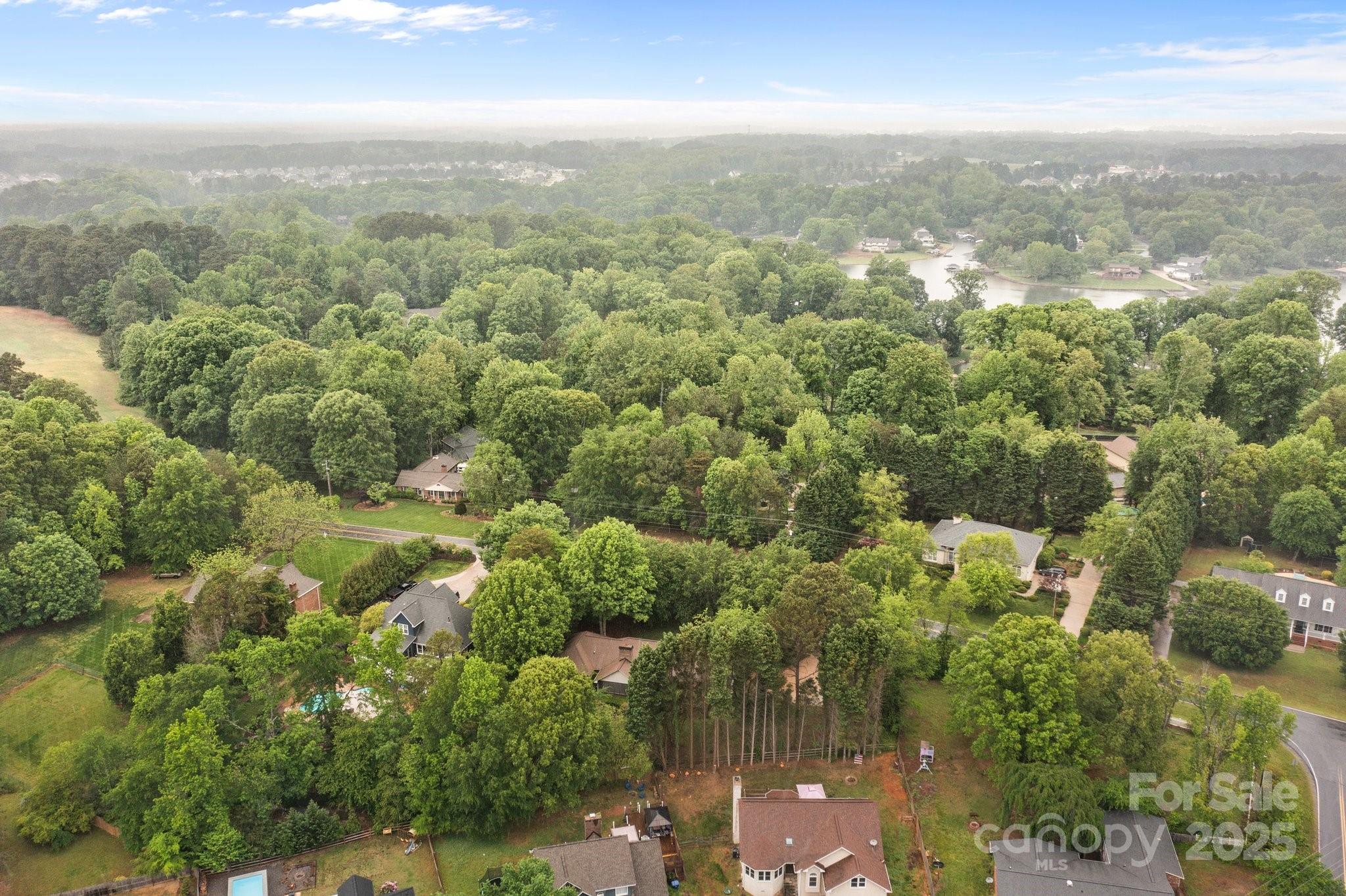 8368 Fairfield Forest Road Denver, NC 28037 - Photo 48 of 48 an aerial view of residential houses with outdoor space and trees