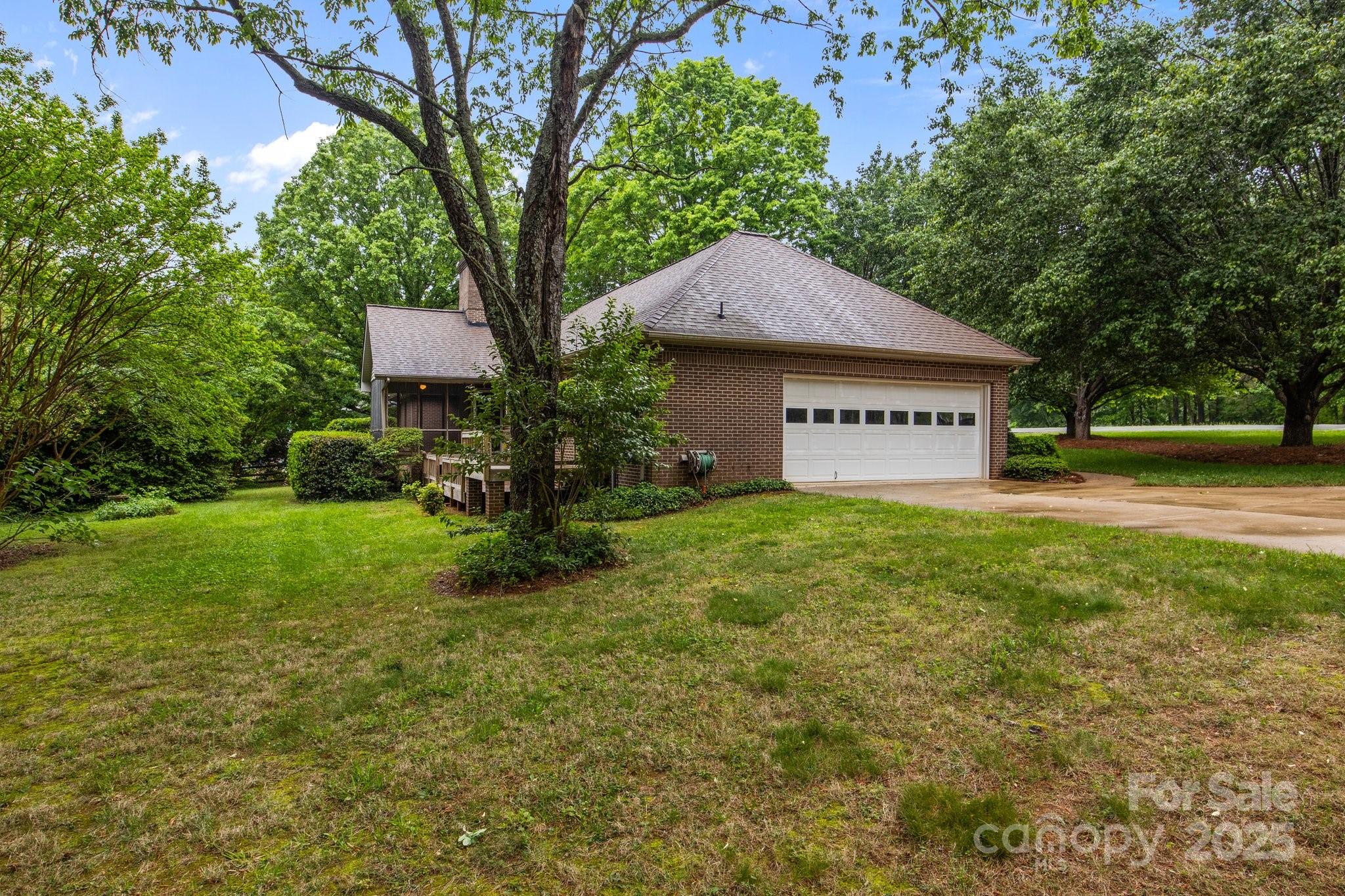 8368 Fairfield Forest Road Denver, NC 28037 - Photo 8 of 48 a house view with a garden space