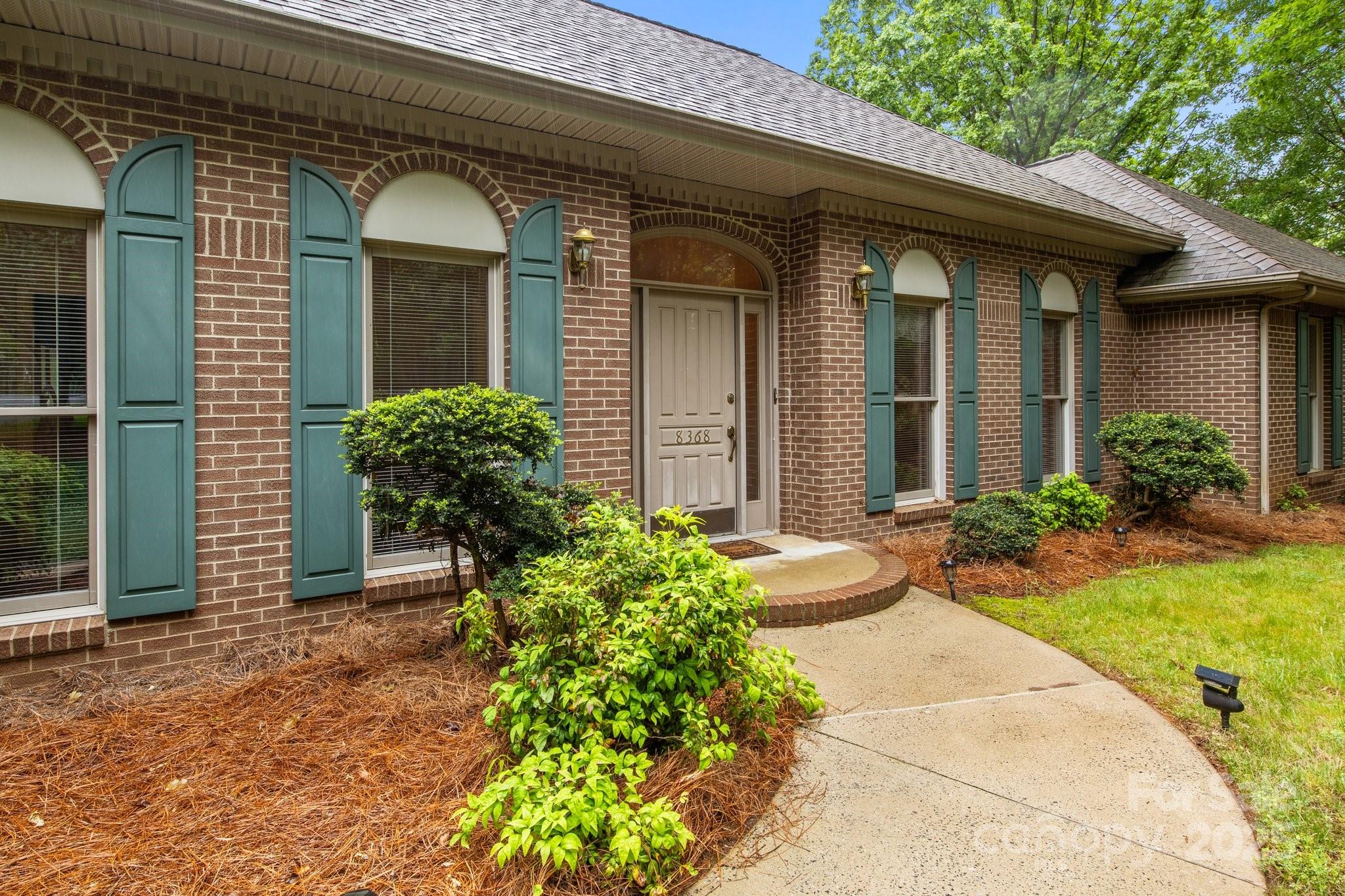 8368 Fairfield Forest Road Denver, NC 28037 - Photo 10 of 48 a front view of a house with garden