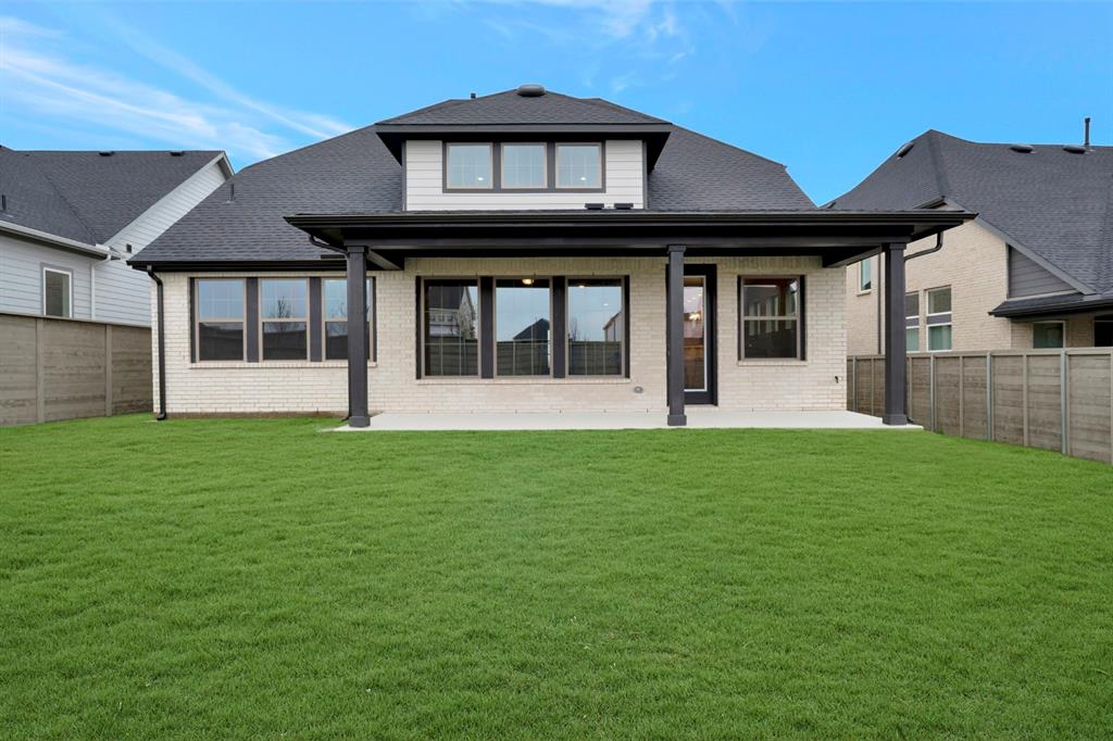 8916 Chestnut Lane Justin, TX 76247 - Photo 2 of 17 a front view of a house with a garden