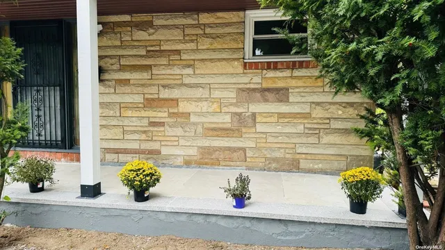 a view of front door of house with potted plant