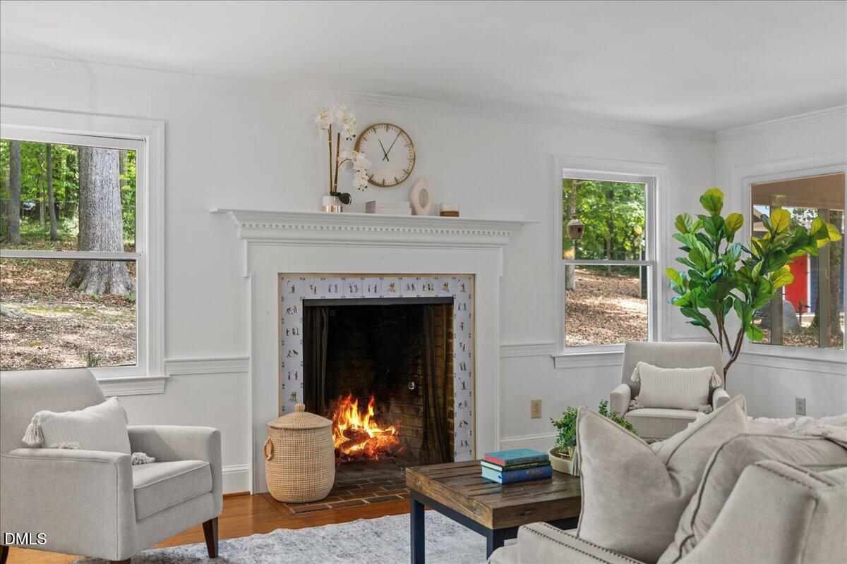 6516 Bakersfield Drive Raleigh, NC 27606 - Photo 8 of 59 a living room with furniture and a fireplace