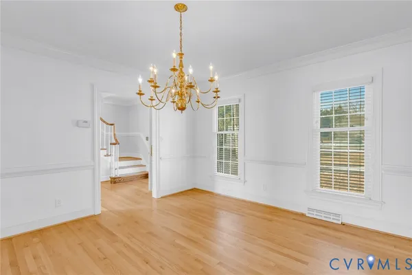 a living room with furniture potted plant and a window