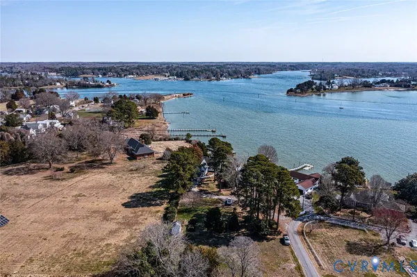 an aerial view of a house with a lake view