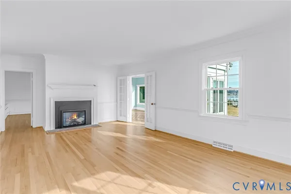 a living room with furniture a window and a fireplace