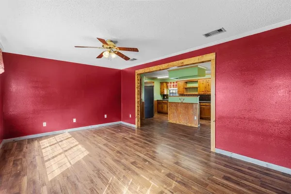 a view of an empty room with a window