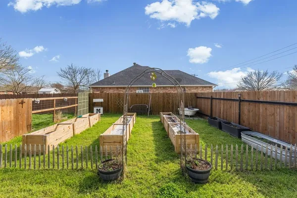 a view of a garden with patio