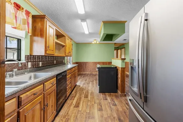 a bathroom with a sink and a large mirror