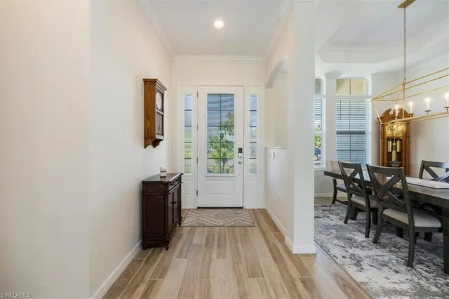 a view of a livingroom with furniture window and wooden floor