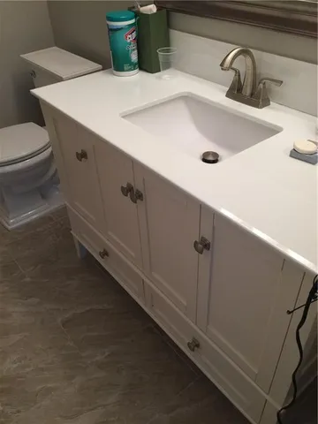 a bathroom with a sink and toilet