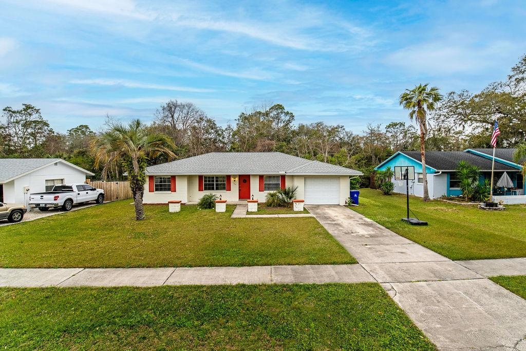 a view of a house with a big yard