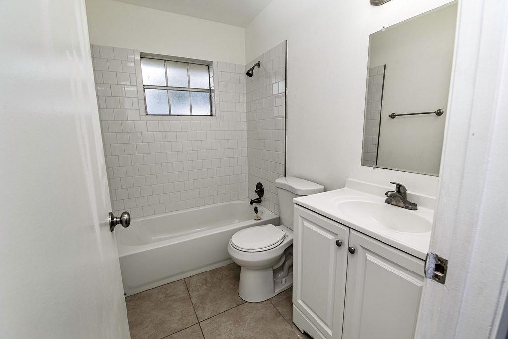 1061 Mindello Avenue St. Augustine, FL 32086 - Photo 21 of 26 a bathroom with a sink a toilet and shower
