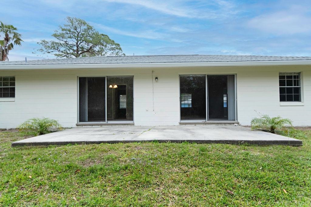 1061 Mindello Avenue St. Augustine, FL 32086 - Photo 25 of 26 a front view of a house with a yard