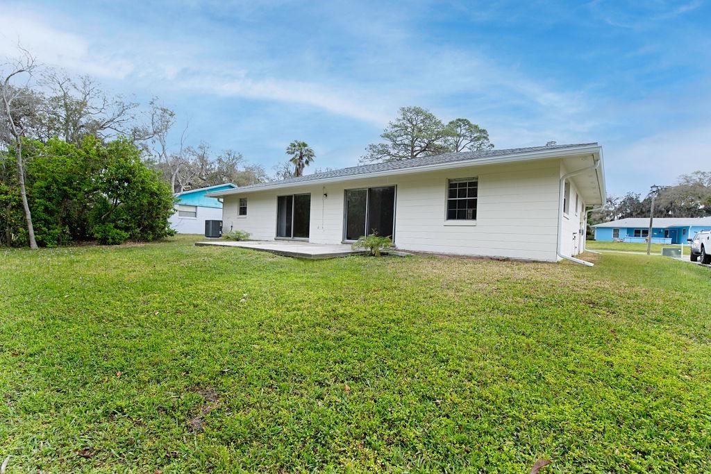1061 Mindello Avenue St. Augustine, FL 32086 - Photo 26 of 26 a view of a house with a yard