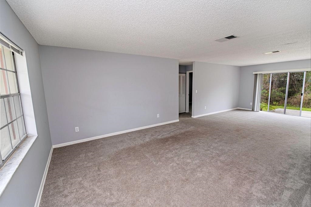 1061 Mindello Avenue St. Augustine, FL 32086 - Photo 4 of 26 a view of an empty room with a window