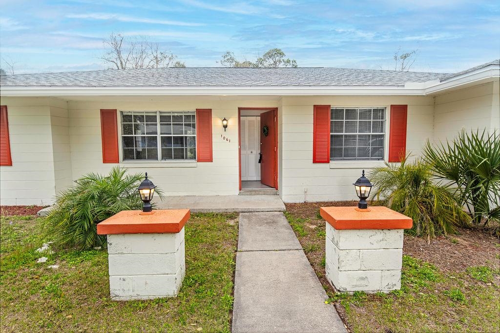 1061 Mindello Avenue St. Augustine, FL 32086 - Photo 5 of 26 a front view of a house with a fountain