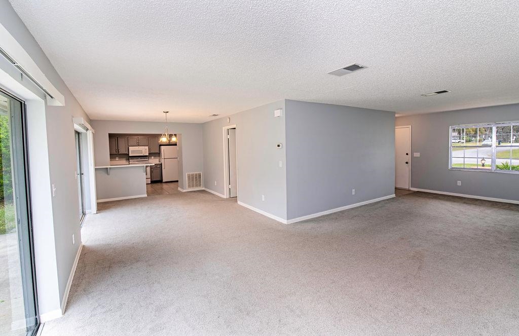 1061 Mindello Avenue St. Augustine, FL 32086 - Photo 8 of 26 a view of a kitchen with a refrigerator and a sink