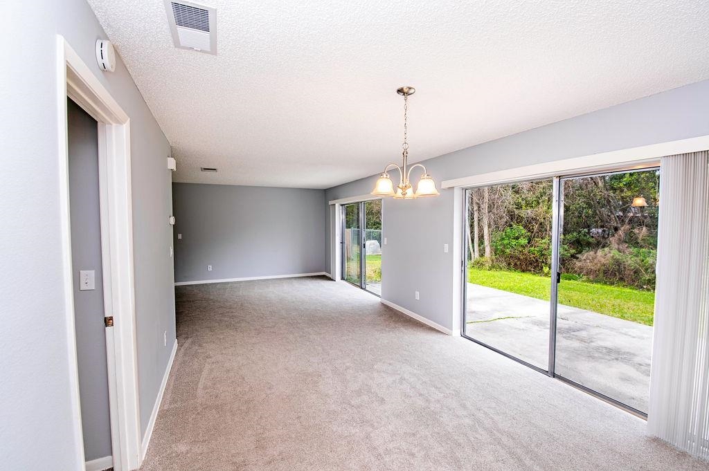 1061 Mindello Avenue St. Augustine, FL 32086 - Photo 9 of 26 a view of an empty room with windows