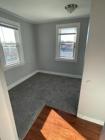 a view of an empty room and window