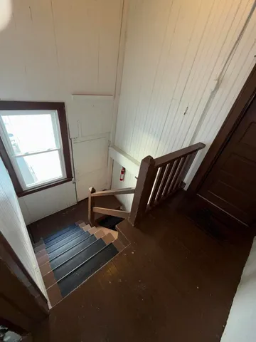 a view of kitchen with furniture and windows